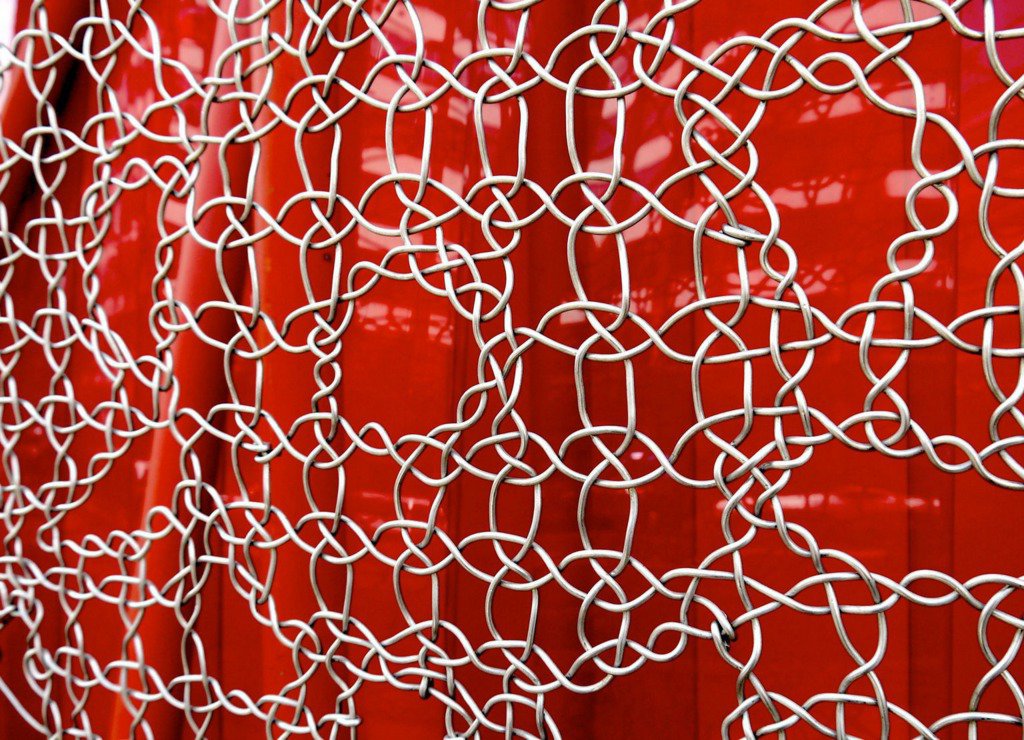 Shoreditch - A woven wire fence of a take away restaurant