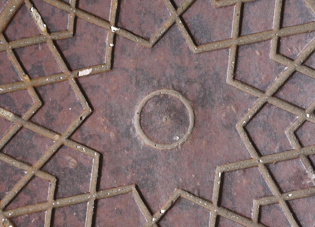 Coal cover - Close-up of an old coal cover on the pavement